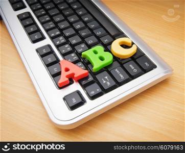 Early education concept with keyboard and letters