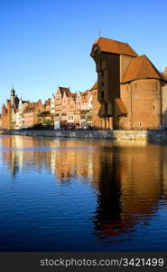 Early morning at scenic waterfront of the Old Town in Gdansk, Poland, on the right side of the image the Crane (Polish: Zuraw)
