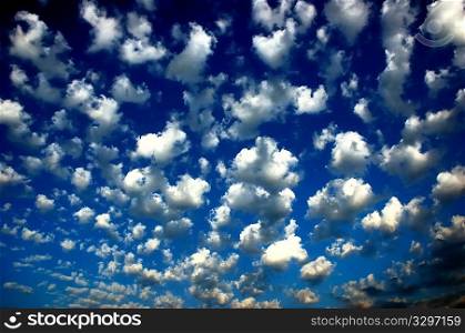 Early morning: blue sky with fluffy clouds