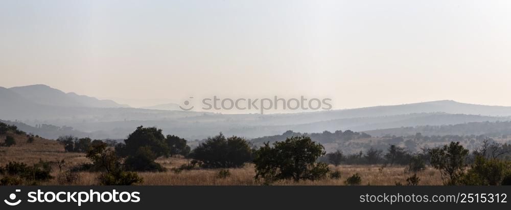 Early morning haze on the hills Magaliesberg South Africa