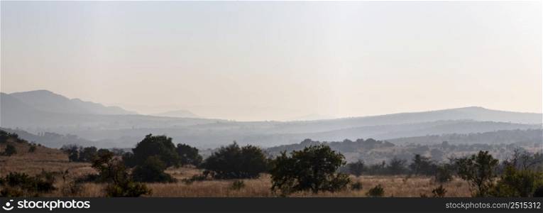 Early morning haze on the hills Magaliesberg South Africa