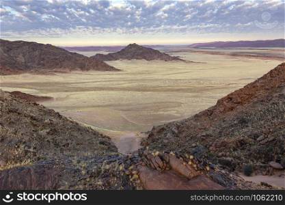 Early morning sunlight on the dramatic desert landscape of the Namib-nuakluft National Park near Sossusvlie in Namibia, Africa.