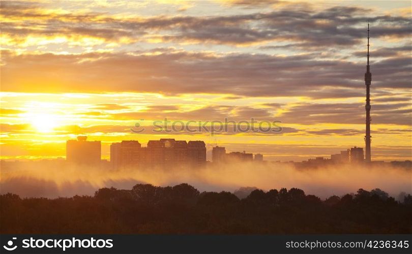 early morning yellow sunrise in autumn city