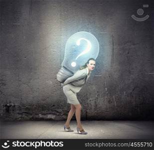 Earning money. Image of businesswoman holding bulb on back