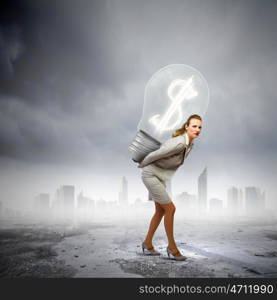 Earning money. Image of businesswoman holding bulb on back