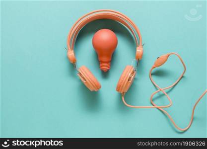 earphones lamp colored surface. High resolution photo. earphones lamp colored surface. High quality photo