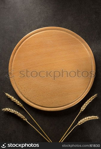 ears of wheat on black background texture