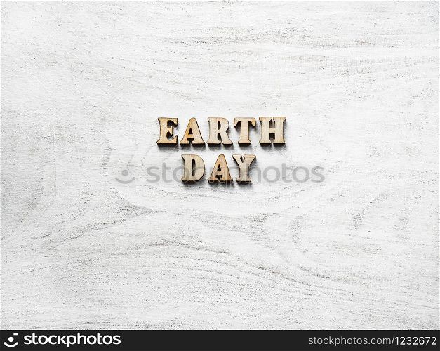 Earth Day. Beautiful greeting card. Isolated background, close-up, view from above, wooden surface. Congratulations for relatives, friends and colleagues. Earth Day. Beautiful greeting card. Top view