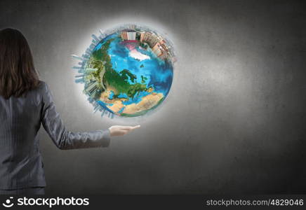 Earth day. Close up of female hand holding our Earth planet. Elements of this image are furnished by NASA