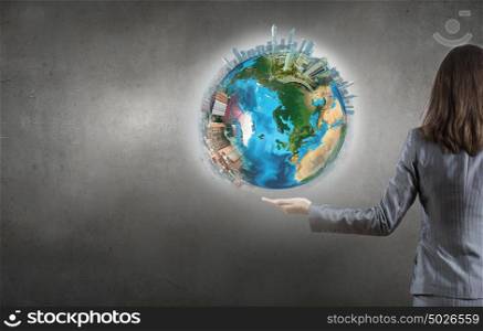Earth day. Close up of female hand holding our Earth planet. Elements of this image are furnished by NASA