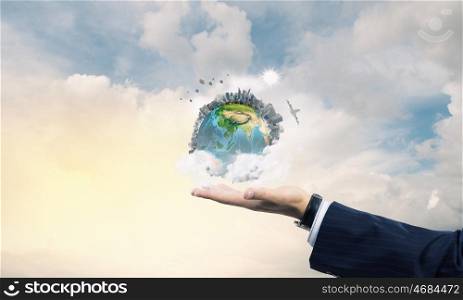 Earth day. Close up of male hand holding our Earth planet. Elements of this image are furnished by NASA