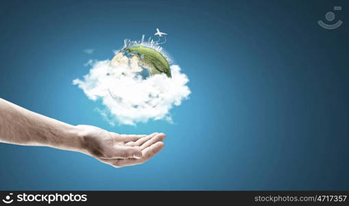 Earth day. Close up of male hand holding our Earth planet. Elements of this image are furnished by NASA