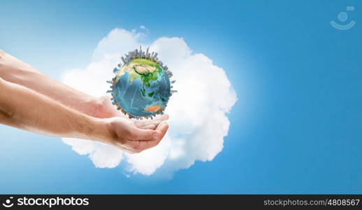 Earth day. Close up of male hand holding our Earth planet. Elements of this image are furnished by NASA