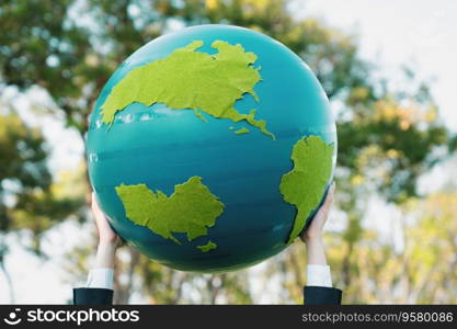 Earth day concept with big Earth globe held by hand up in sky to promote environmental awareness to solve global warming with environmentally sustainability and ESG principle. Gyre. Earth day concept with big Earth globe held by hand up in sky. Gyre