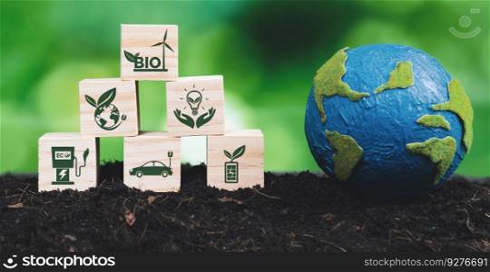Earth model and eco concept wooden icons symbolizing green busi≠ss utilizing bio power technology and environmental conservation for sustainab≤eco-friendly e≠rgy for c≤an future. A<er