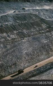 Earth moving trucks, open cut gold mine, Telfer, Western Australia