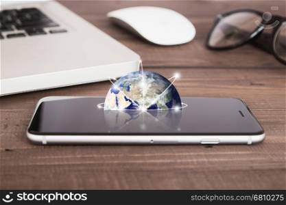 earth on phone screen network concept elements of this image furnished by nasa
