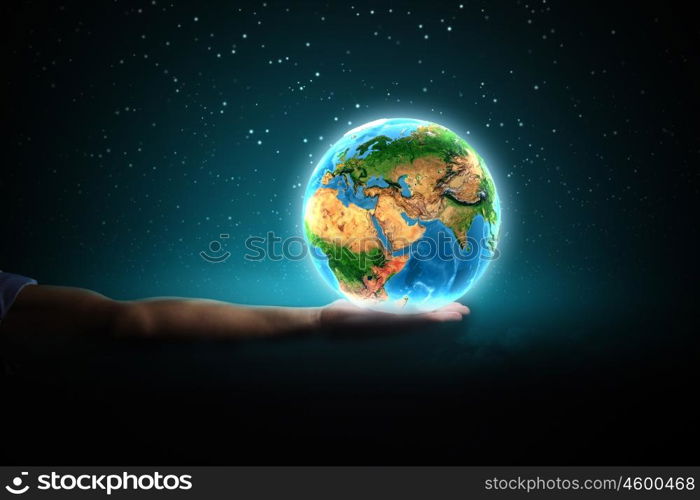 Earth planet. Close up of human hand holding Earth planet. Elements of this image are furnished by NASA