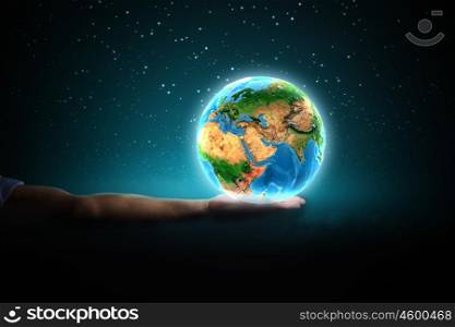 Earth planet. Close up of human hand holding Earth planet. Elements of this image are furnished by NASA
