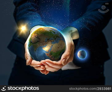 Earth planet in hands