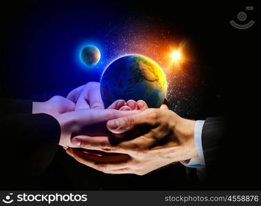 Earth planet in hands. Close up image of human hands holding earth planer. Ecology concept