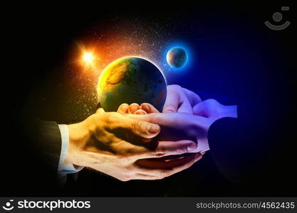 Earth planet in hands. Close up image of human hands holding earth planer. Ecology concept