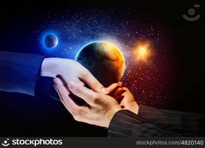 Earth planet in hands. Close up image of human hands holding earth planer. Ecology concept