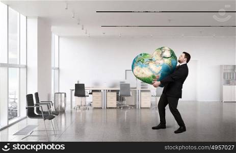 Earth planet in our hands. Businessman holding world in his hands. Elements of this image are furnished by NASA