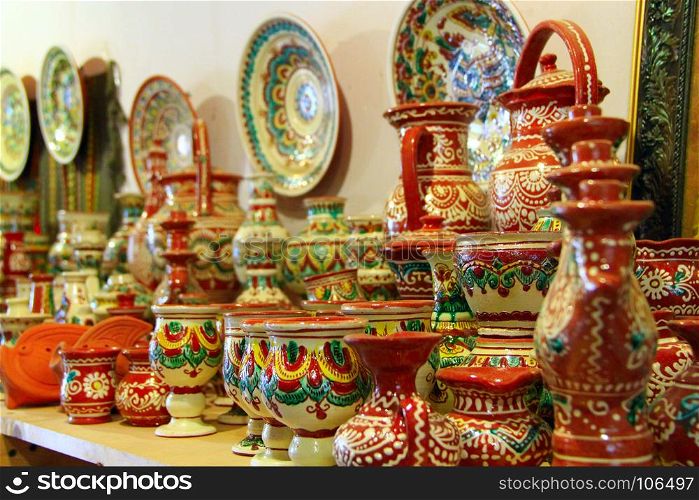 earthenware on the shelves of shop. earthenware on the shelves of pottery shop