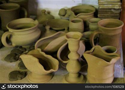 earthenware on the shelves of shop. earthenware on the shelves of pottery shop