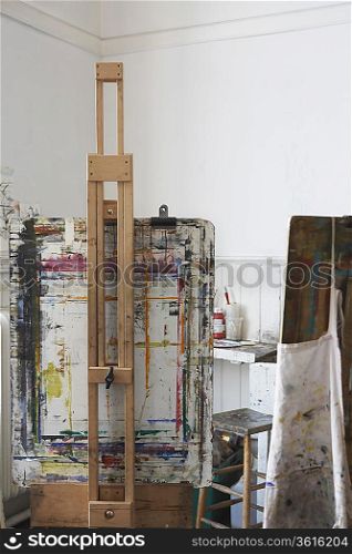 Easel and canvases in artist&acute;s studio