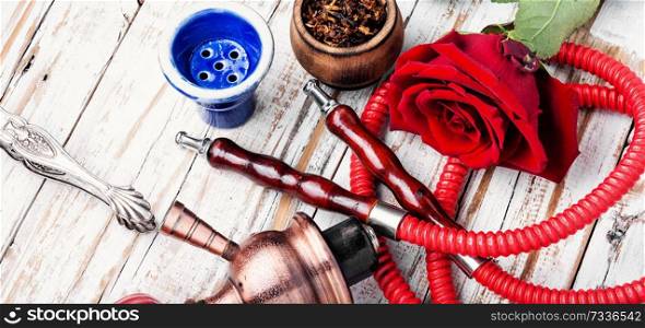 East hookah with flower aroma for relax.Shisha hookah.Smoking a hookah. Smoking hookah with rose flavor