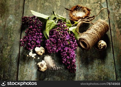 Easter background with eggs, nest and flowers