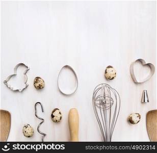 Easter baking set on white wooden background, place for text, top view