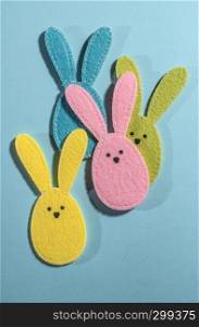 Easter bunnies on bright blue background.