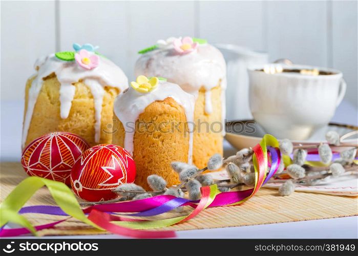 Easter cake and egg Pysanka on a white background