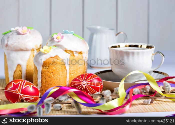 Easter cake and egg Pysanka on a white background