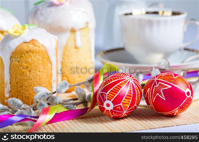 Easter cake and egg Pysanka on a white background