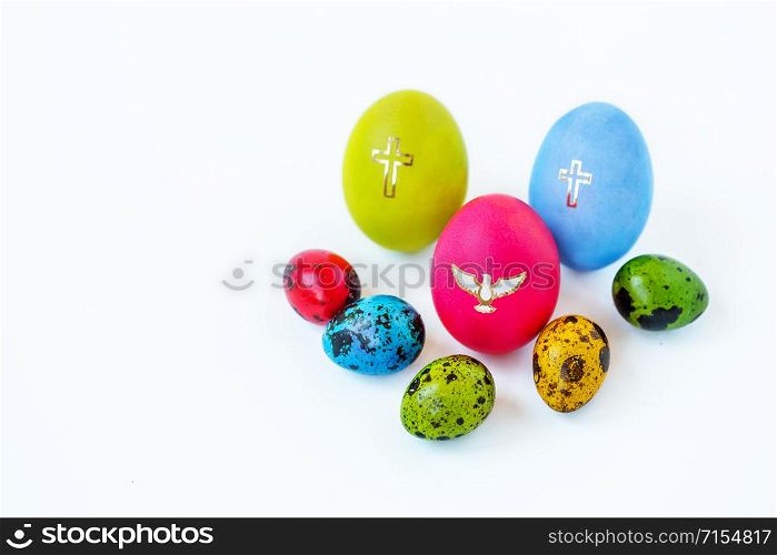 Easter composition of painted eggs on a white background. Background for greeting card.. Easter composition of painted eggs on a white background.