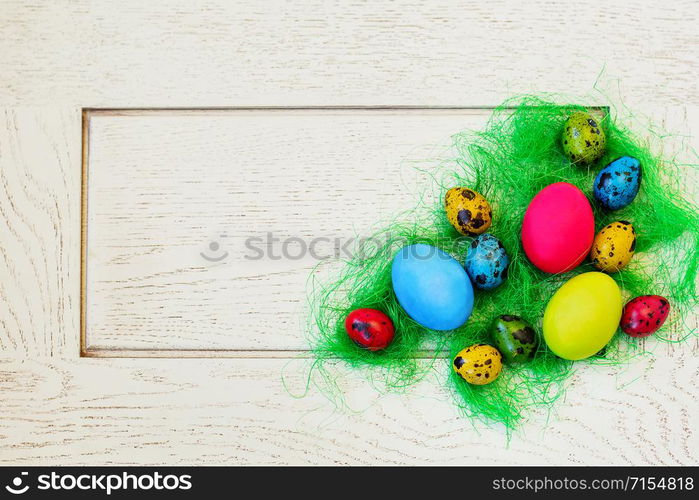 Easter composition of painted eggs on a white background. Background for greeting card.. Easter composition of painted eggs on a white background.