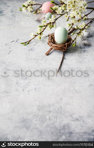 Easter composition on grey concrete backgrount, copy space