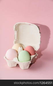 Easter composition on pink pastel background