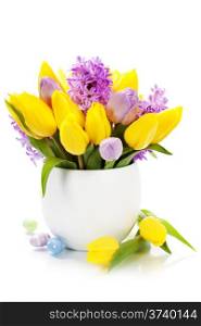 Easter composition with Beautiful spring flowers in vase over white