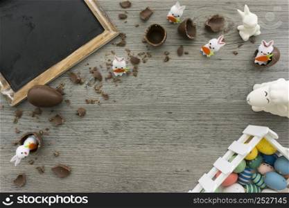 easter day composition with chocolate eggs rabbits