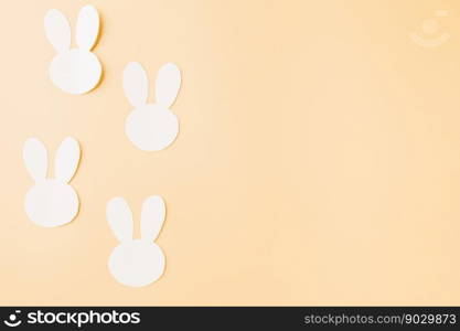 Easter Day Concept. Above overhead handmade white paper rabbit cutting isolated on pastel background with copy space for your text, Happy Easter Bunny holiday, Banner design for web