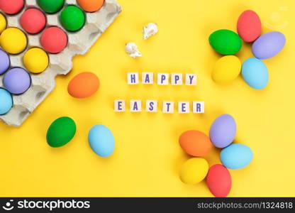 Easter day little Bunny rabbit with decorated eggs on yellow background