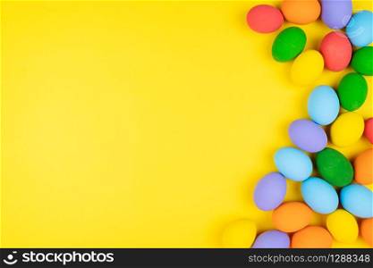 Easter day with decorated eggs on yellow background
