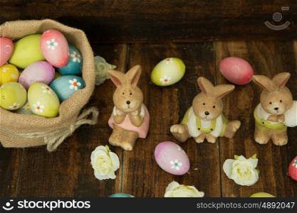 Easter decoration. Colourful eggs and funny rabbits