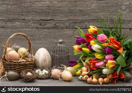 easter decoration with eggs and tulip flowers. nostalgic still life. vintage style home interior