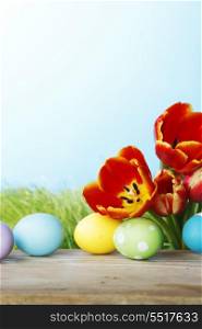 Easter decoration with tulips and colored eggs